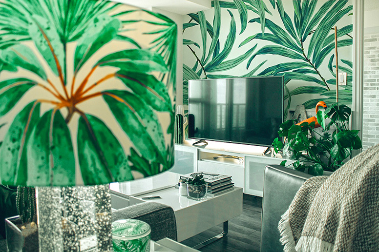 Living room with a botanical mural on the wall